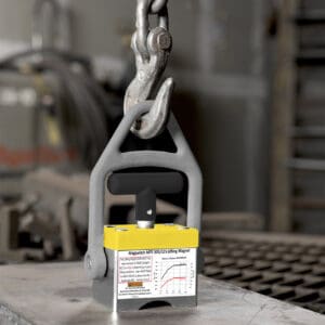 Industrial lifting magnet with chain attached.