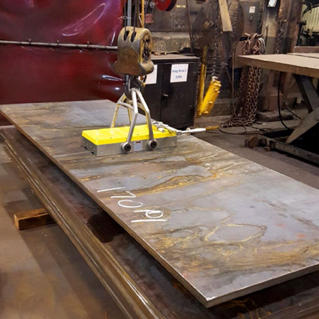 Metal sheet with magnetic lifting tool.
