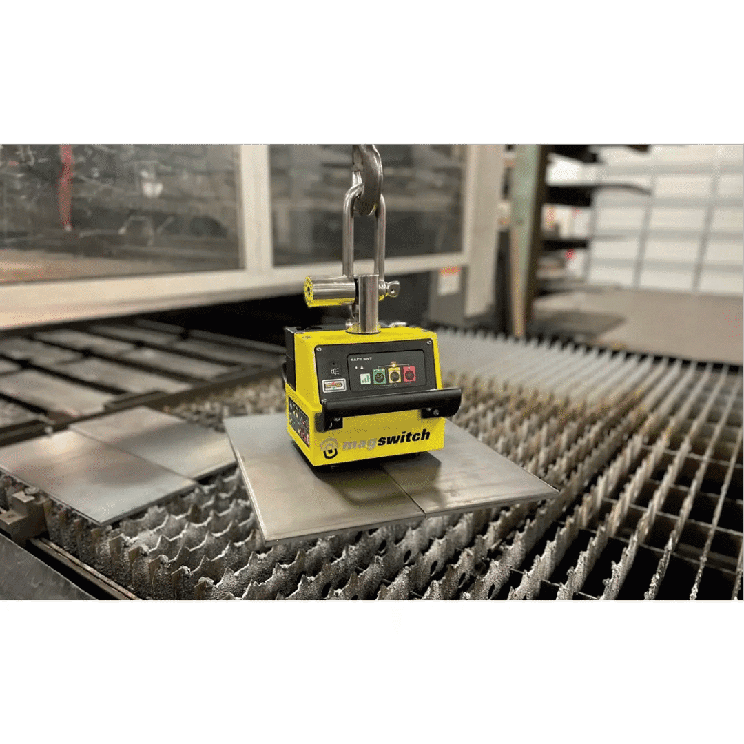 Magnetic lifter holding a metal sheet.