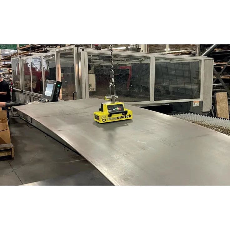 Magnetic lifter lifting large metal sheet.